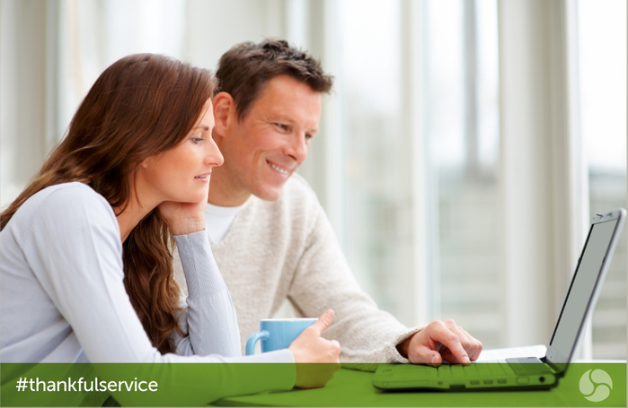 Couple viewing laptop screen Couple viewing laptop screen